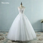 Pearl Ball Gown with intricate lace bodice, pearl embellishments, and voluminous white tulle skirt in classic ball gown silhouette