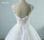 Pearl Ball Gown wedding dress in white with lace applique and pearl embellishments on a lace-up corset back