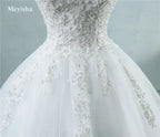 Pearl Ball Gown wedding dress with white lace bodice and delicate floral appliques on voluminous tulle skirt