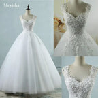 Pearl Ball Gown wedding dress in white with intricate lace and pearl embellishments on bodice and straps, full tulle skirt