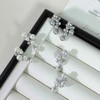 Pearl Cluster Earrings with white synthetic pearls and sparkling zircon stones set in 925 sterling silver in an elegant cluster design