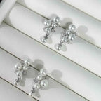 Pearl Cluster Earrings with white synthetic pearls and small zircon accents set in 925 sterling silver in a clustered design