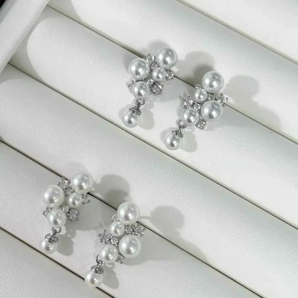 Pearl Cluster Earrings with white synthetic pearls and small zircon accents set in 925 sterling silver in a clustered design