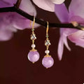 Pearl Drop Earrings featuring gold-plated hooks, enamel floral details, small pearls, and large lavender resin beads