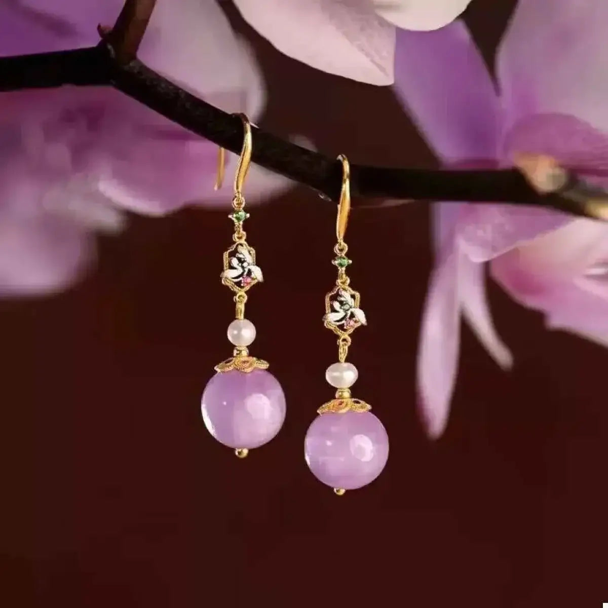 Pearl Drop Earrings featuring gold-plated hooks, enamel floral details, small pearls, and large lavender resin beads