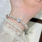 Pearl Zircon Bracelet featuring synthetic pearls and sparkling zircon stones on alloy chain worn on wrist