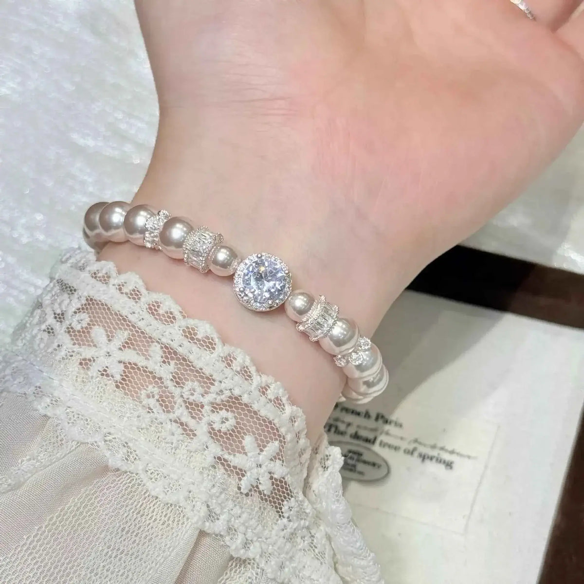 Pearl Zircon Bracelet featuring synthetic pearls and sparkling zircon stones on alloy chain worn on wrist