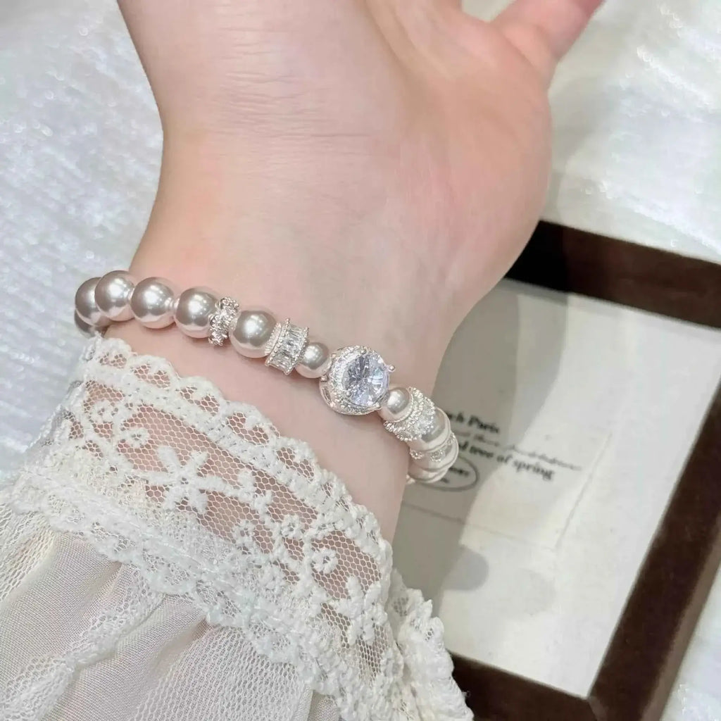 Pearl Zircon Bracelet featuring synthetic white pearls and sparkling zircon accents with silver-tone alloy detailing
