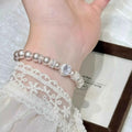 Pearl Zircon Bracelet featuring synthetic white pearls and sparkling zircon accents with silver-tone alloy detailing