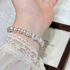 Pearl Zircon Bracelet featuring synthetic white pearls and sparkling zircon accents with silver-tone alloy detailing
