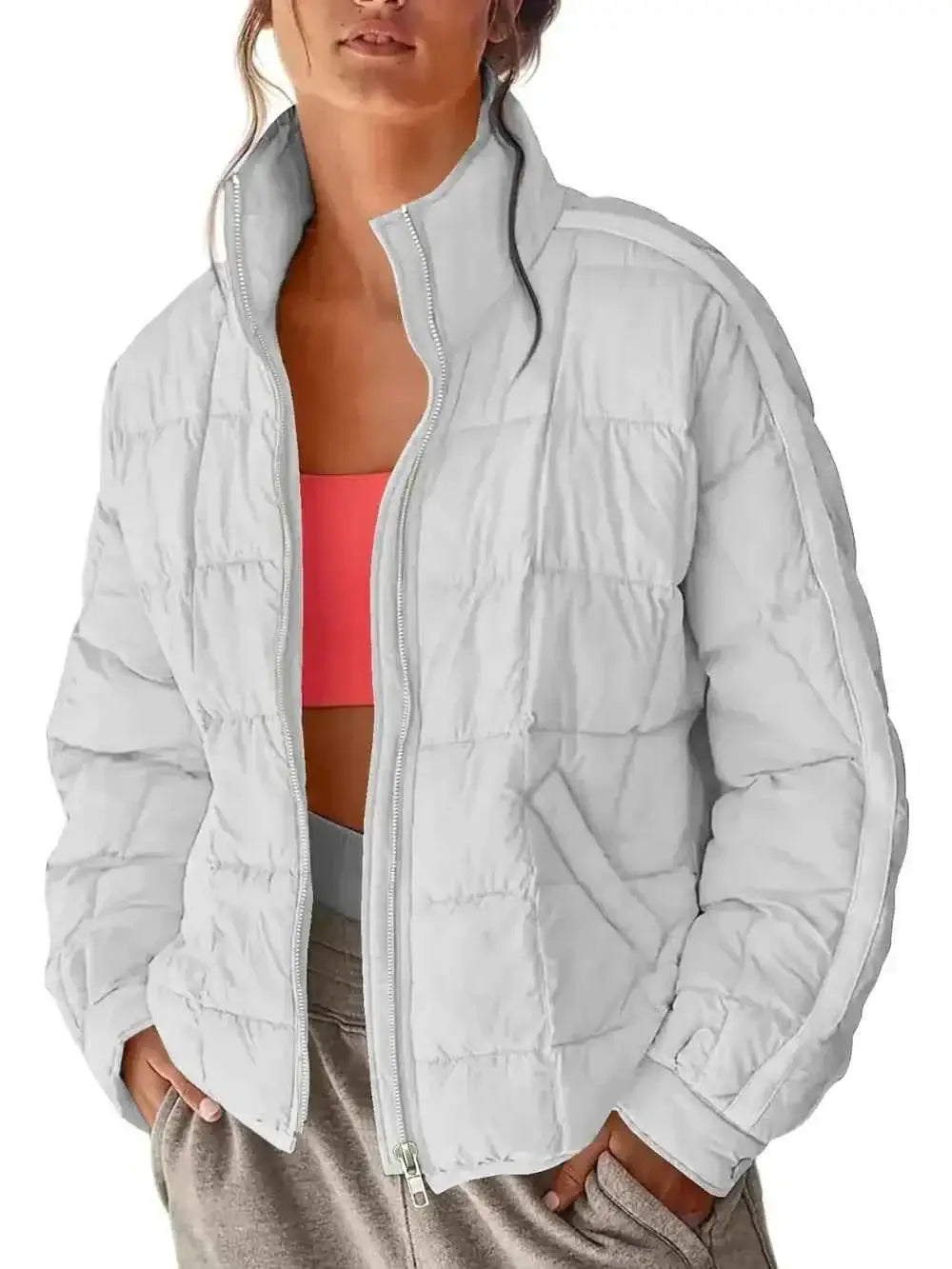 Pocketed Plaid Quilted white quilted zip-up winter coat with a high collar and side pockets worn over a coral top