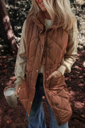 Pocketed Zipper and Button Vest in brown quilted polyester with snap buttons, zipper closure, and side pockets worn over beige knit sweater