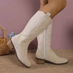 Point Toe Block Heels boots in beige suede with side zipper and low wooden block heels featuring subtle stitched patterns