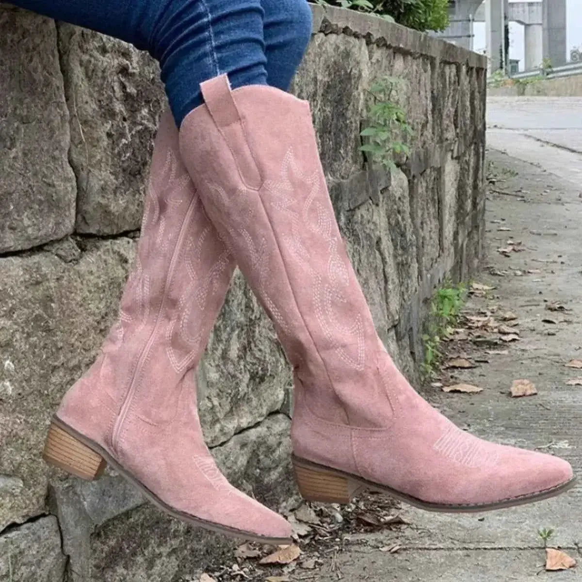 Point Toe Block Heels boots in dusty pink suede with decorative stitching and wooden block heels for mid-height support.