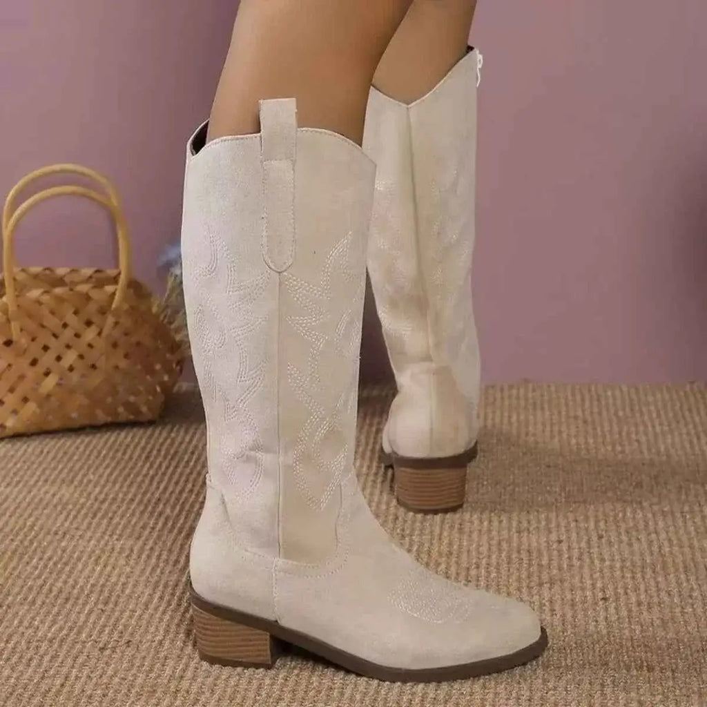 Point Toe Block Heels boots in cream suede with decorative stitching and mid-height wooden block heels on a textured sole
