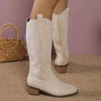 Point Toe Block Heels boots in cream suede with decorative stitching and mid-height wooden block heels on a textured sole