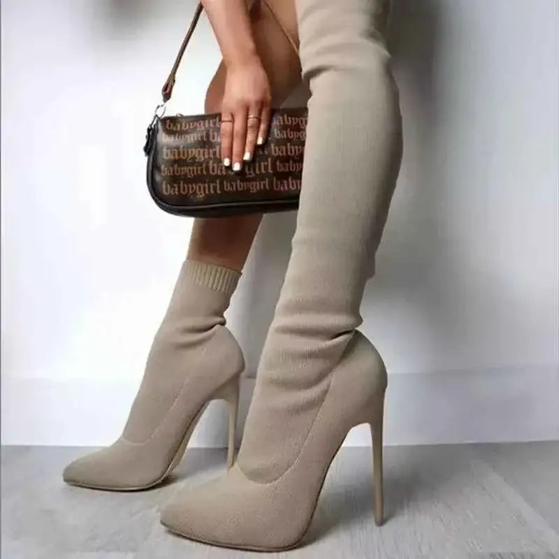 Point Toe Stiletto Boots in beige knit material with high stiletto heels and a sock-like fit extending above the ankle.