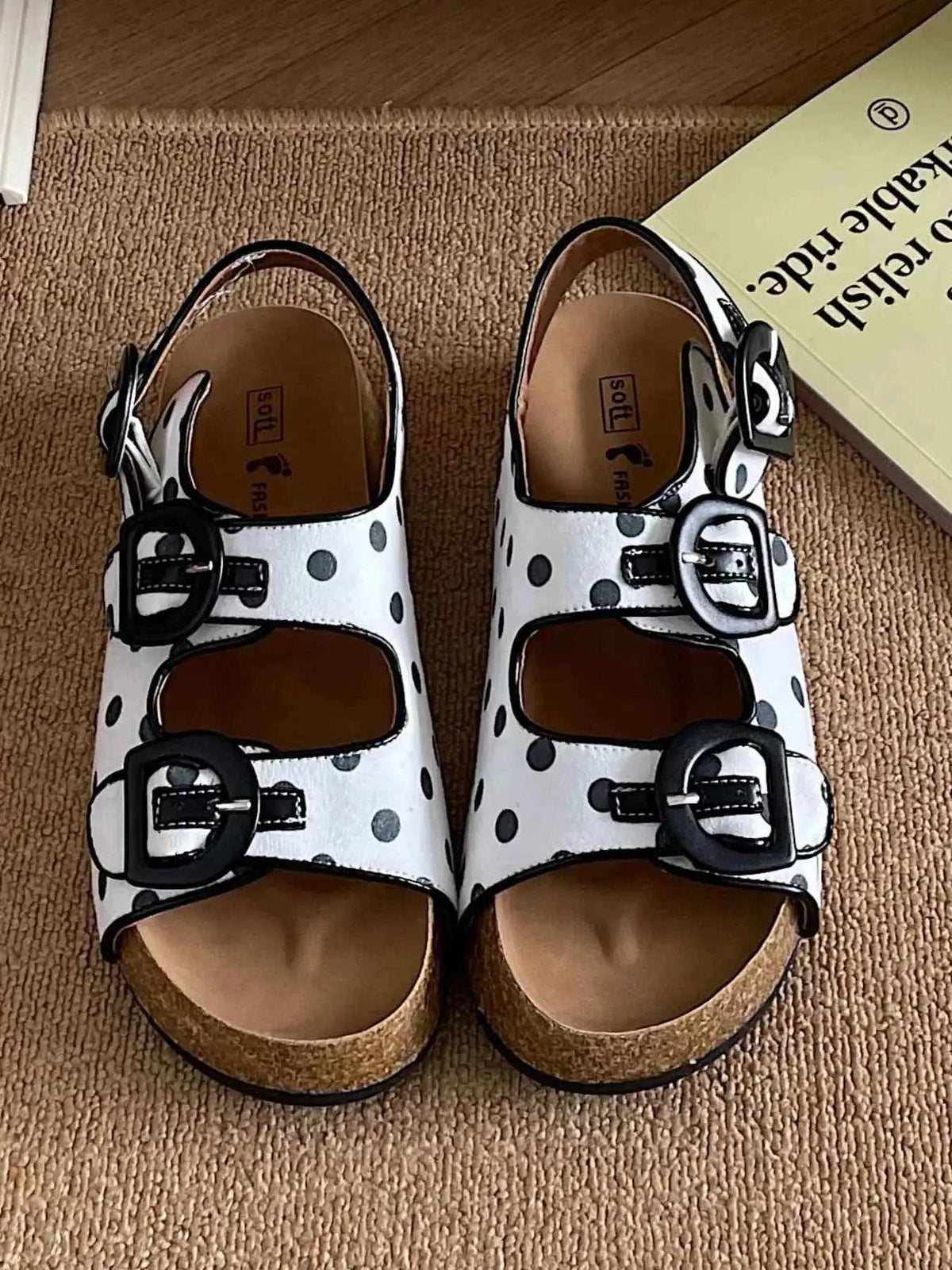 Polka Dot Double Buckle platform sandals in white with black polka dots, two black buckles, and a cork sole