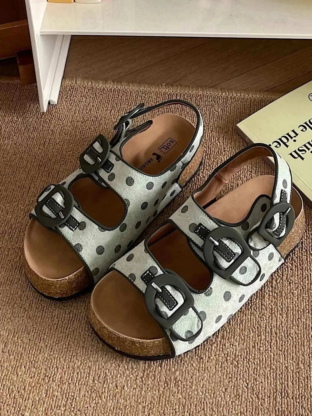 Polka Dot Double Buckle platform sandals in white with black polka dots, dual black buckles, cork sole, and open toe design