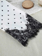 Polka Dot Lace Trim cami sleeve edge with black lace trim on white fabric featuring black polka dots, delicate floral lace detail