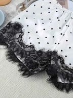 Polka Dot Lace Trim white fabric shorts with black polka dots and detailed black lace trim edges, slightly stretchy polyester
