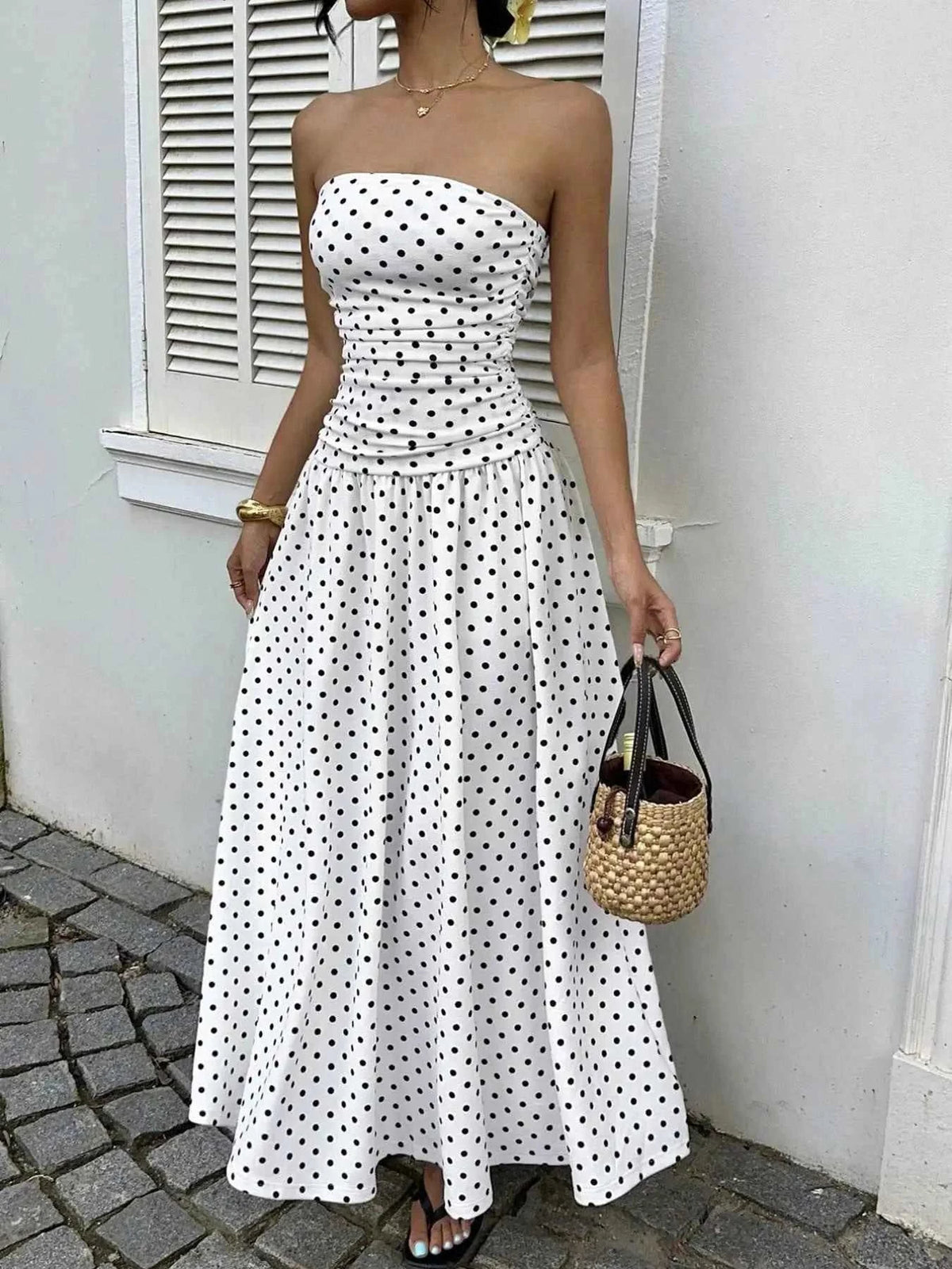 Polka Dot Ruched strapless maxi dress in white polyester with black polka dots and ruched bodice detail