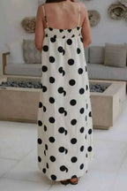 Polka Dot Spaghetti Straps Maxi Dress with black polka dots on white fabric, featuring a smocked back and thin shoulder straps