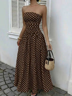 Polka Dot Strapless Maxi Dress in brown with white polka dots, fitted bodice, flowing skirt, and no stretch fabric