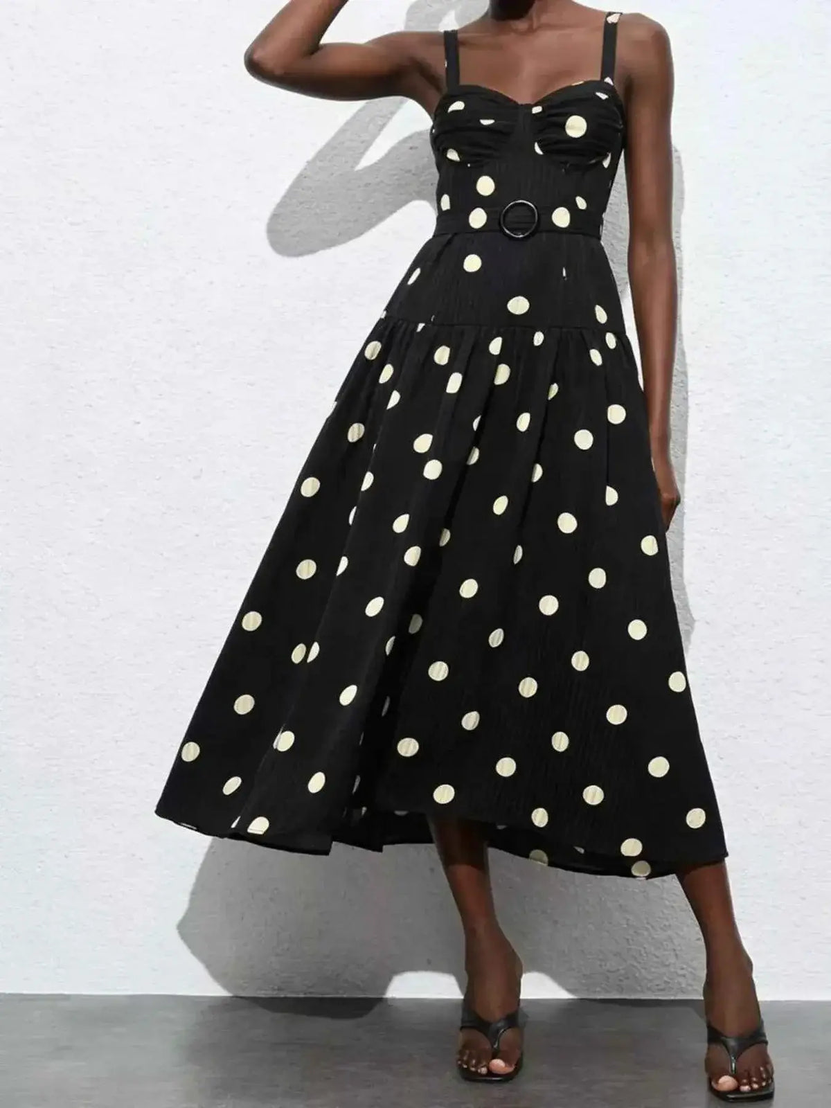 Polka Dot Sweetheart Neck Midi Dress in black with white polka dots, sleeveless with thin straps and a belted waist