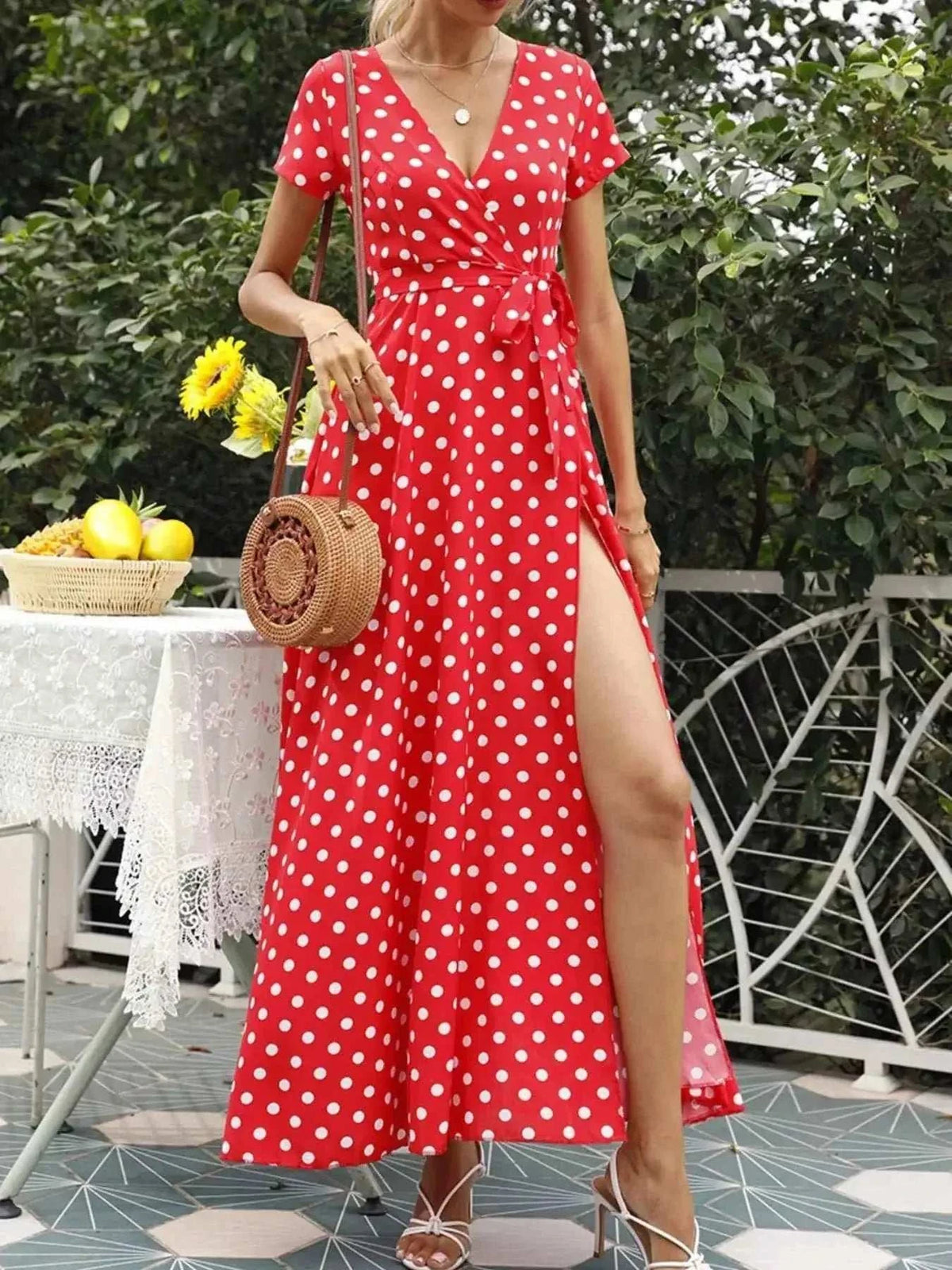 Polka Dot Wrap Maxi Dress in vibrant red with white polka dots, short sleeves, V-neck, belted waist, and side slit