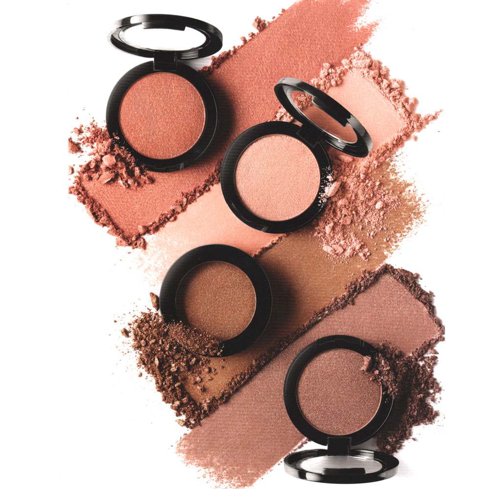 Pretty Perfect Set featuring four shimmering pressed powders in peach, pink, bronze, and nude shades with a buttery texture for eyes and cheeks