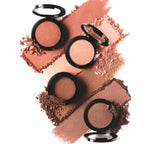Pretty Perfect Set featuring four shimmering pressed powders in peach, pink, bronze, and nude shades with a buttery texture for eyes and cheeks