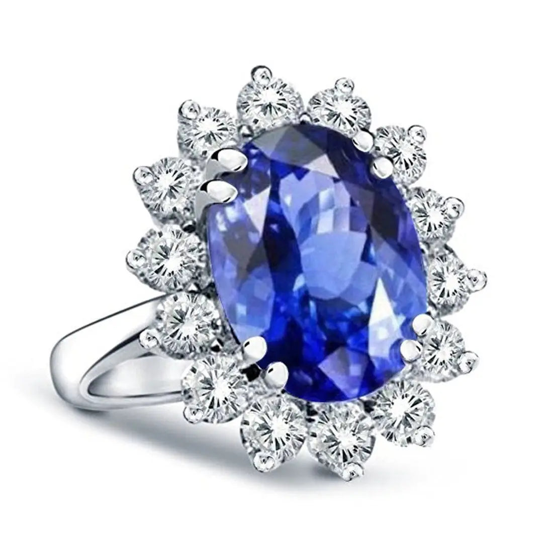 Princess Diana inspired 14K white gold ring with a large oval lab-grown blue sapphire surrounded by a halo of sparkling round diamonds