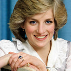 Princess Diana inspired elegant ring featuring a deep blue oval sapphire with a sparkling diamond halo set in white gold