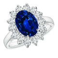 Princess Diana inspired 14K white gold ring featuring a deep blue lab-grown oval sapphire surrounded by a halo of sparkling round diamonds
