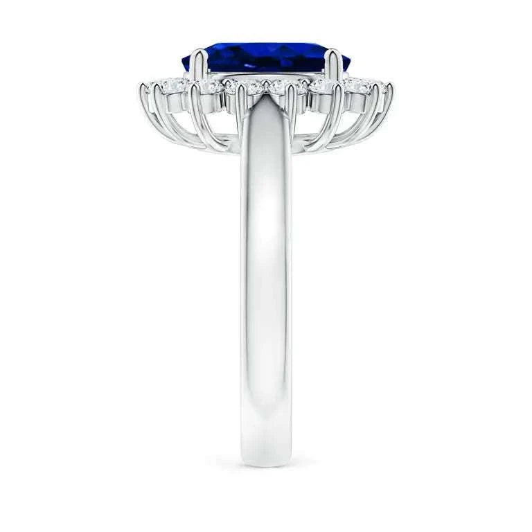 Princess Diana inspired 14K white gold ring featuring a deep blue oval lab-grown sapphire center with a sparkling diamond halo