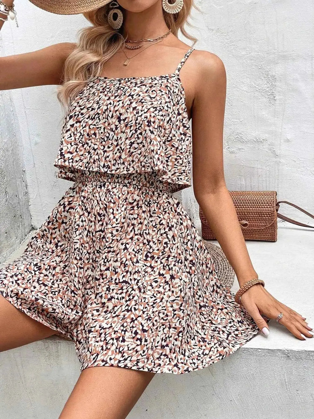 Printed Spaghetti Strap Romper with beige, black, and white abstract pattern, lightweight fabric, and ruffled layered design