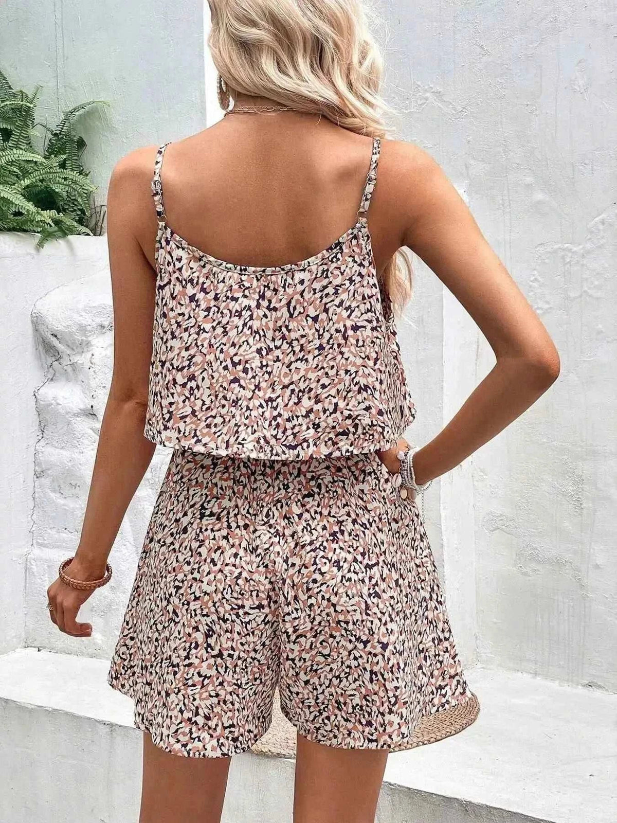 Printed Spaghetti Strap Romper in a beige and black abstract pattern with lightweight fabric and an elastic waist design
