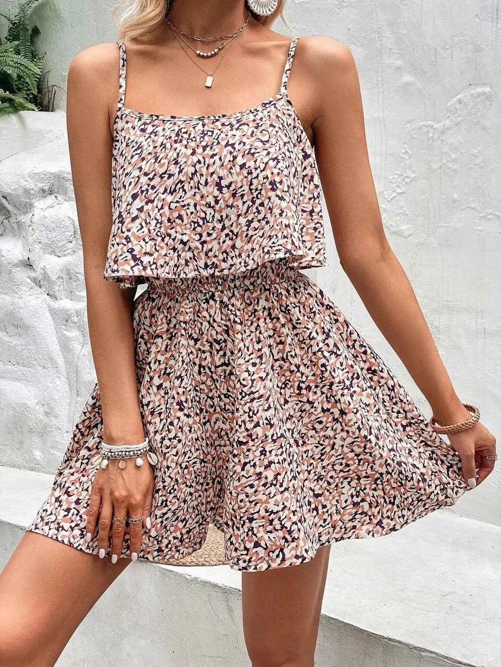 Printed Spaghetti Strap Romper in beige and black abstract print, sleeveless with ruffled bodice and elastic waist