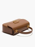 Small brown PU Leather Crossbody Bag with smooth texture, gold-tone hardware, and a rectangular buckle closure detail.