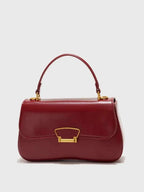 PU Leather Crossbody Bag in deep red with a smooth finish, gold-tone clasp, and a single top handle design.