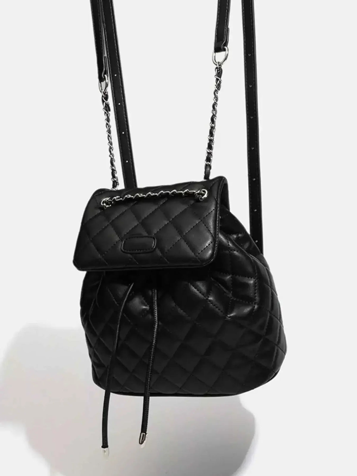 Mini black PU leather Quilted Chain Flap Backpack with diamond quilted pattern and chain-accented flap straps