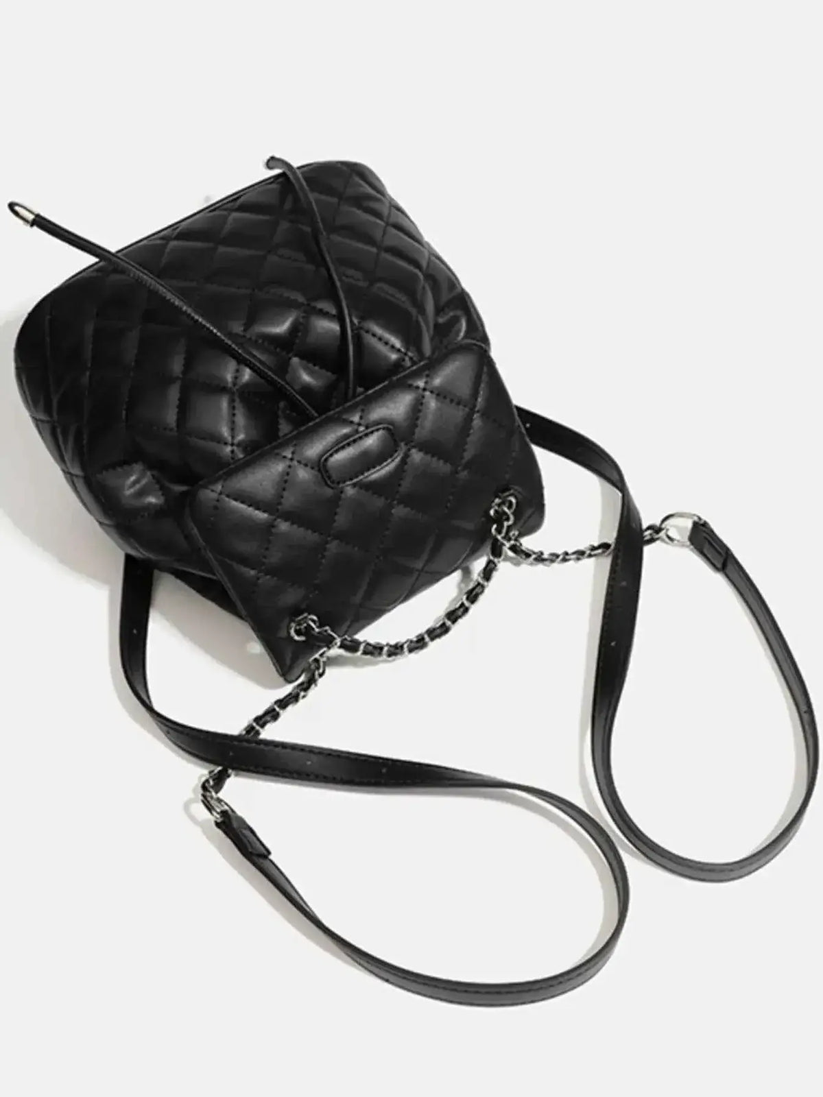 Mini black PU leather Quilted Chain Flap Backpack with diamond quilting pattern and silver chain strap detailing