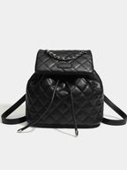 Mini black PU leather Quilted Chain Flap Backpack with diamond quilted pattern and silver chain detail on flap handle