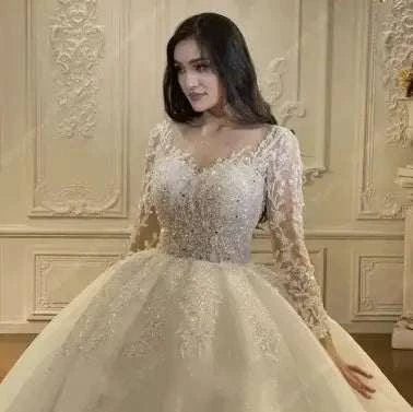 Regal Sparkle Ball Gown wedding dress in ivory with embroidered organza and tulle, lace appliques, off the shoulder long sleeves, and a sweetheart neckline