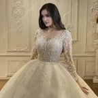 Regal Sparkle Ball Gown wedding dress in ivory with embroidered organza and tulle, lace appliques, off the shoulder long sleeves, and a sweetheart neckline