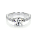 Round Brilliant Diamond engagement ring with 14K white gold band and channel-set side diamonds sparkling brightly