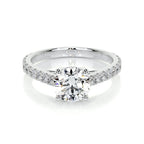 Round Brilliant Diamond engagement ring with 14K white gold band and channel-set side diamonds sparkling brightly