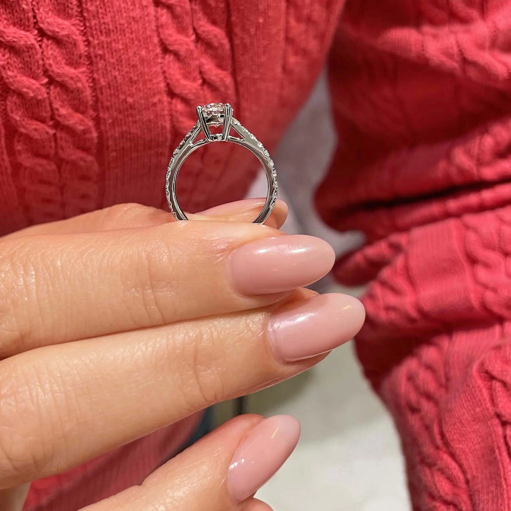 Round Brilliant Diamond engagement ring with a round brilliant center stone and channel-set side diamonds in 14K white gold