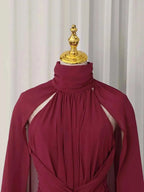 Ruched Halter Neck burgundy polyester maxi dress with asymmetric cape sleeves and gathered detailing at neckline